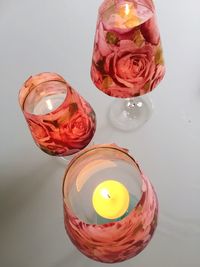 High angle view of roses in glass on table
