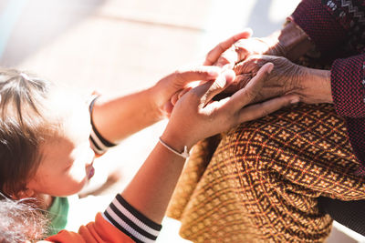 Close-up of woman holding hands