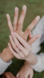 Cropped image of couple holding hands