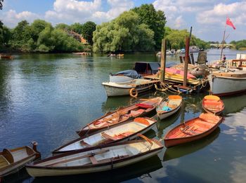 Boats moored in lake