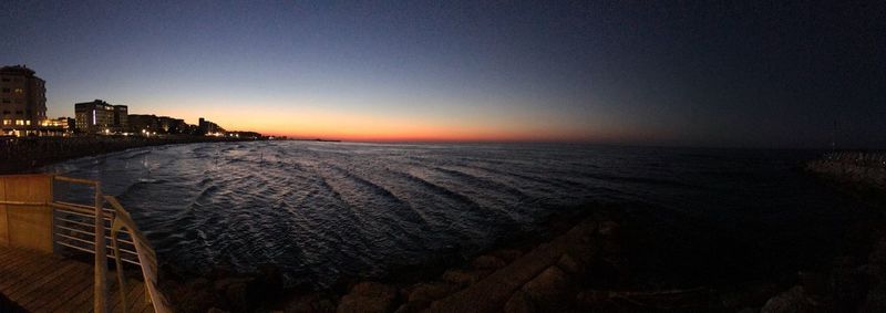 Scenic view of sea against clear sky during sunset