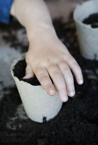 Child planting in pot