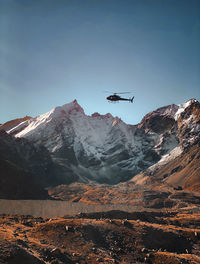 Scenic view of snowcapped mountains against clear sky