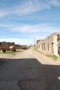 View of old building against cloudy sky