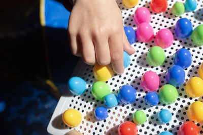 Cropped hand of woman holding pills