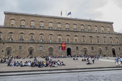 Group of people on the wall of a building