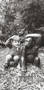 Portrait of boy wearing sunglasses against trees