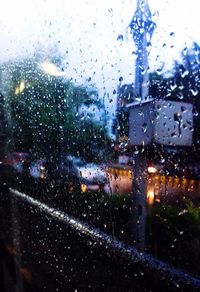 Close-up of wet car window in rainy season