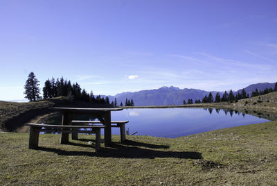 Scenic view of playground against blue sky