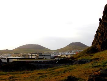 Scenic view of landscape and mountains against sky