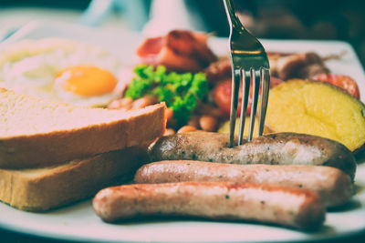 Close-up of meat and bread on plate