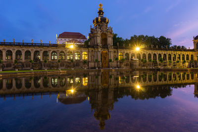 Reflection of building in water at night