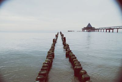 Pier on sea against sky