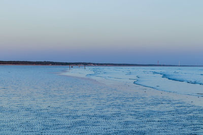 Scenic view of frozen sea against clear sky during winter