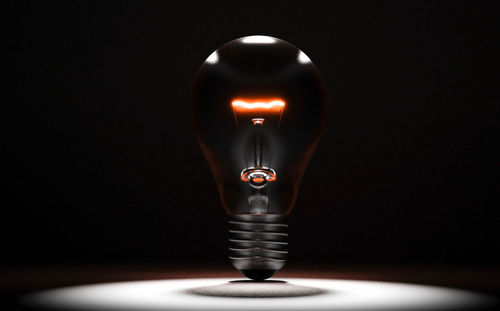 Close-up of illuminated light bulb