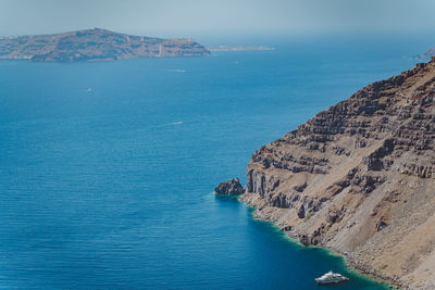 High angle view of sea and rocks against sky