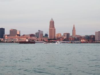 Sea with buildings in background