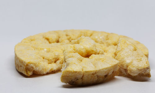 Close-up of burger against white background