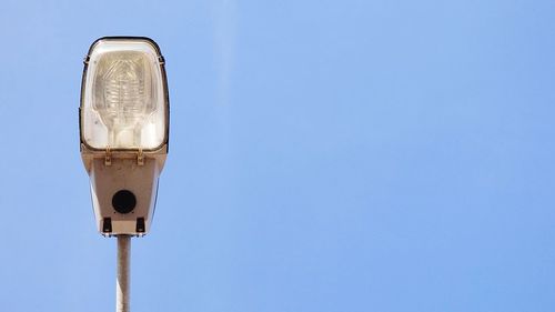 Low angle view of street light against clear sky