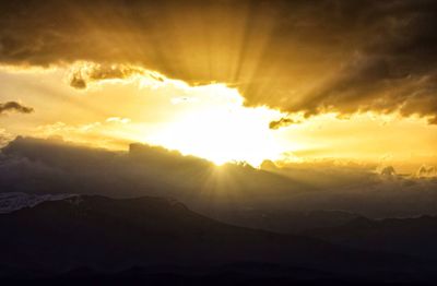 Scenic view of mountains against sky during sunset