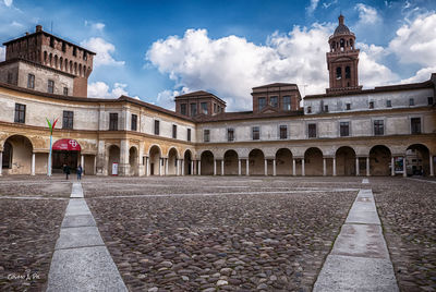 View of old building against cloudy sky