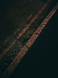 Close-up of railroad track at night