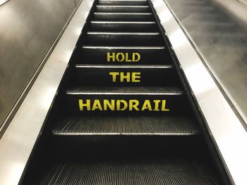 High angle view of text on escalator