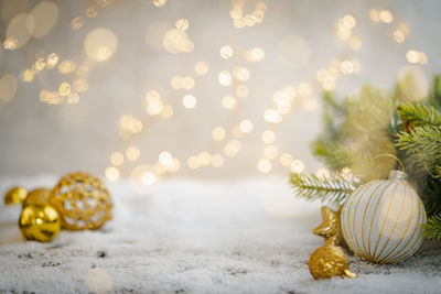 Close-up of christmas decorations on snow