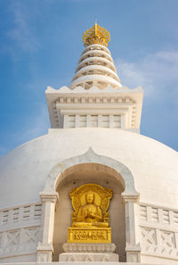 Buddhist stupa isolated with amazing blue sky from unique perspective