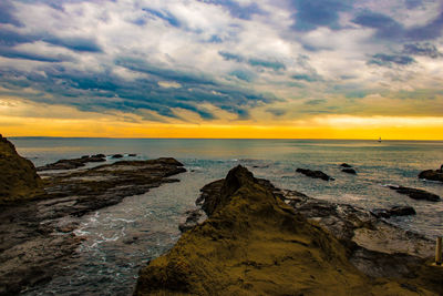 Scenic view of sea against sky during sunset