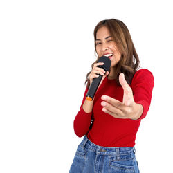 Young woman smiling against white background