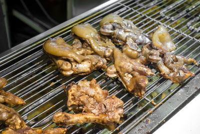 Delicious roast pig's feet on the grill