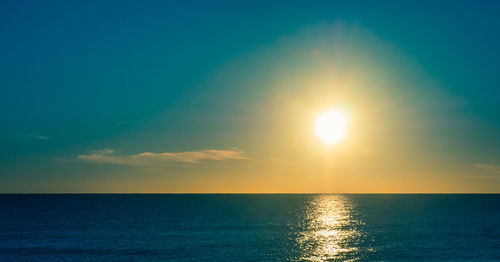 Scenic view of sea against blue sky