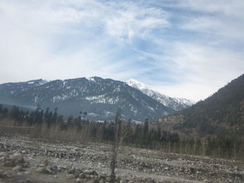 Scenic view of mountains against sky during winter