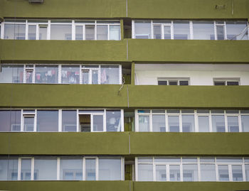 Shot of building with green balconies and floors