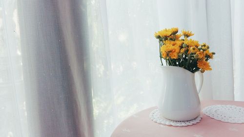 Close-up of vase on table at home