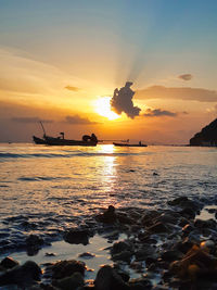 Scenic view of sea against sky during sunset