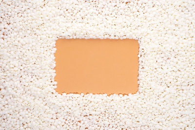 Soy wax on beige background with copy space for design, text. frame border. mockup blank copy space