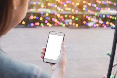 Midsection of man using mobile phone