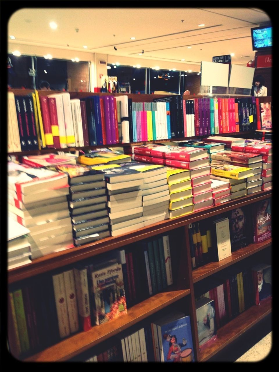 indoors, multi colored, variation, large group of objects, arrangement, shelf, book, in a row, bookshelf, choice, education, order, abundance, transfer print, table, collection, auto post production filter, colorful, still life, retail