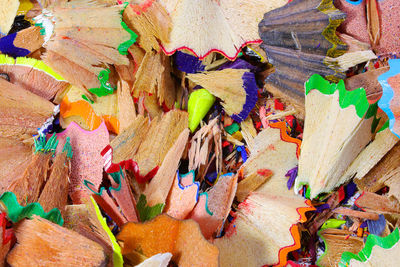 Woody shavings of colored pencils usable as a background for school activities