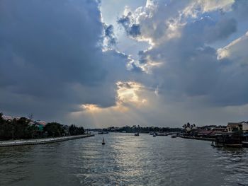 Panoramic view of sea and buildings against sky
