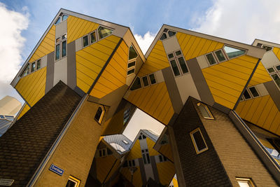 Low angle view of yellow buildings against sky