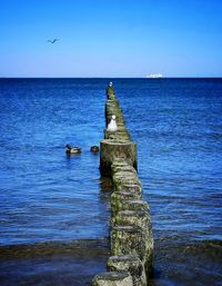 Scenic view of sea against clear blue sky