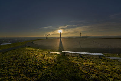 Scenic view of field against sky during sunset