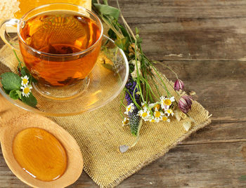 High angle view of various flowers in glass on table