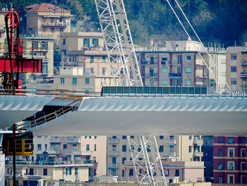 The lifting by hydraulic jacks of a steel beam of the new highway bridge under construction in genoa