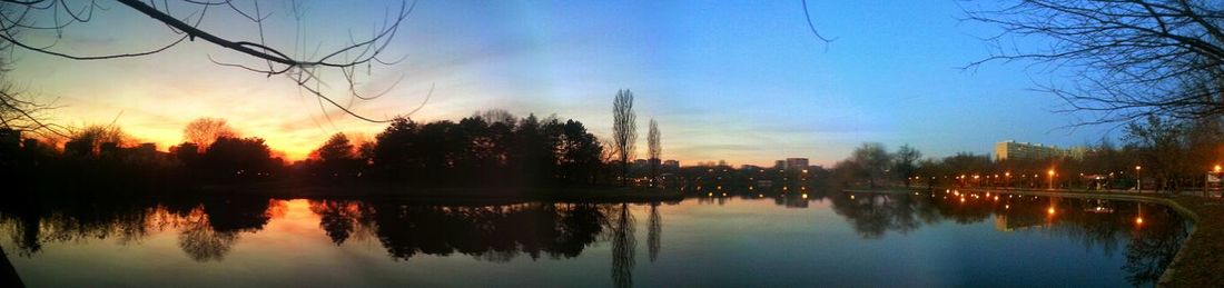 Scenic view of lake at sunset