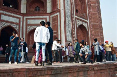 Tourists by historic building