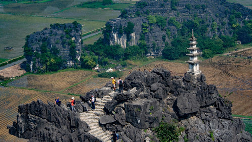 High angle view of people on rock